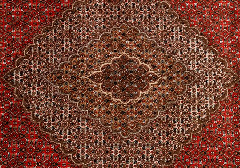 A carpet, Tabriz, part silk, 40-50 Radj, ca 300 x 195 cm.