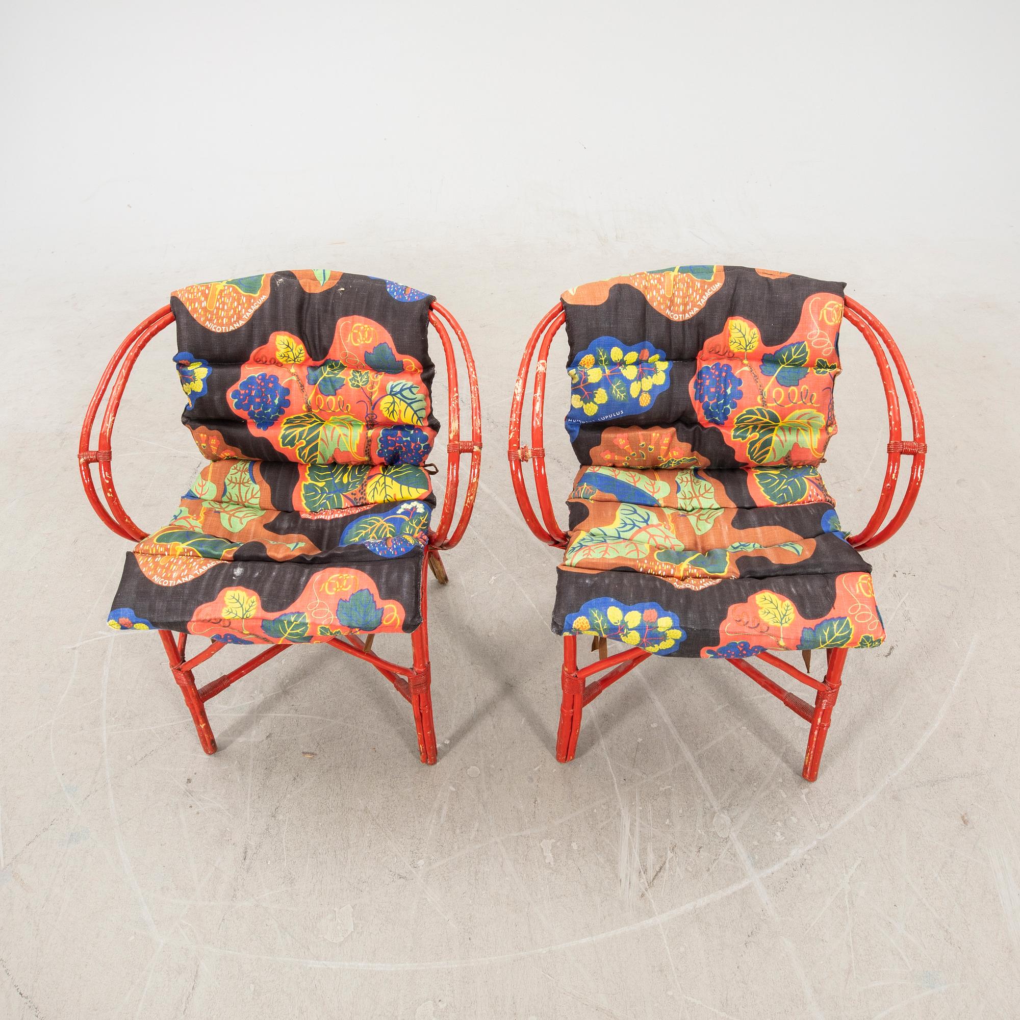 A pair of painted rattan armchairs possibly by Svenskt Tenn.