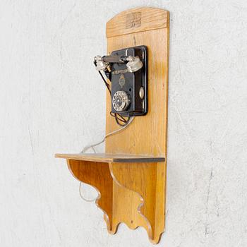 A wall mounted telphone, early 20th century.