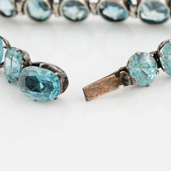 Silver and blue zircon bracelet.