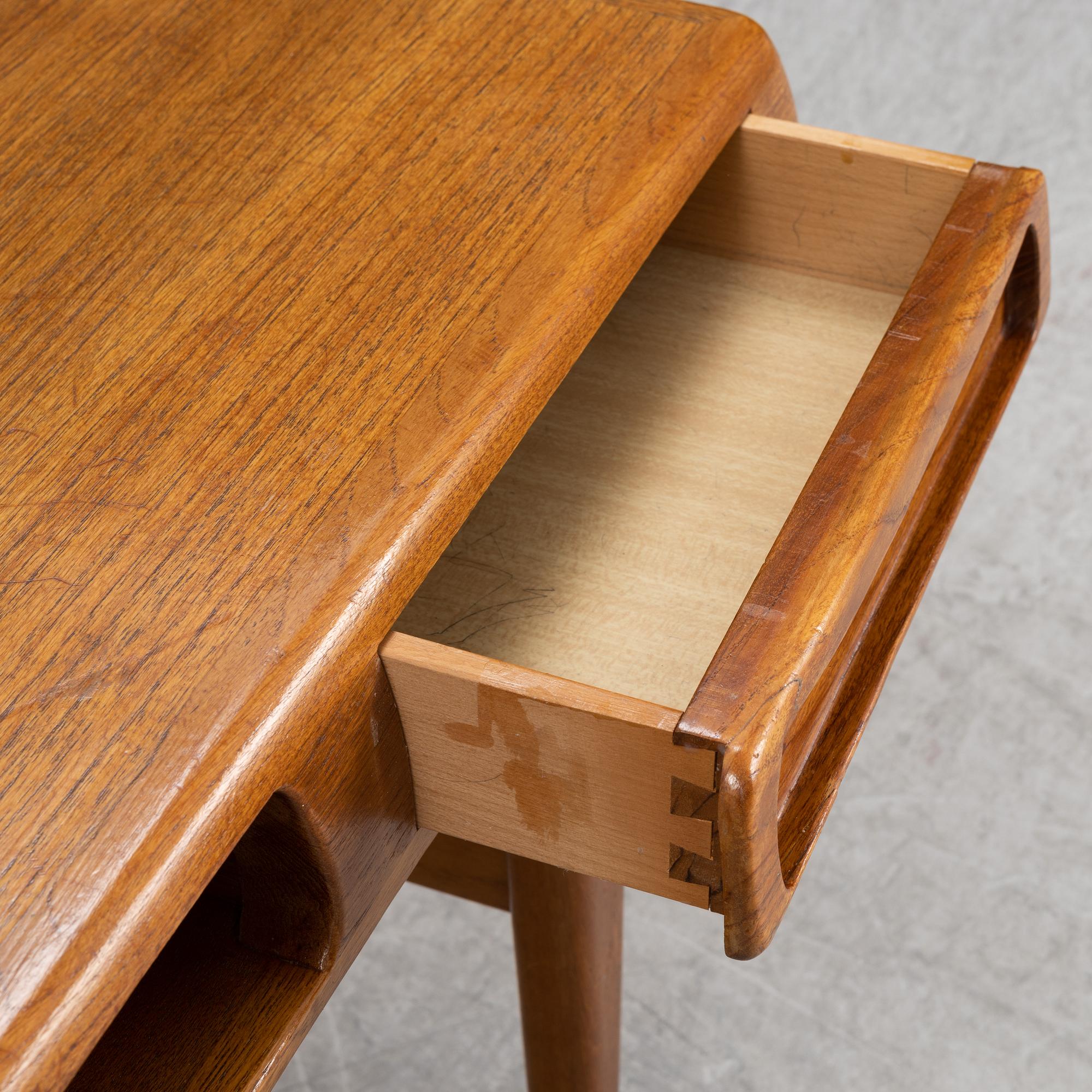 Johannes Andersen, a teak veneered coffee table, Trensum, 1960's.