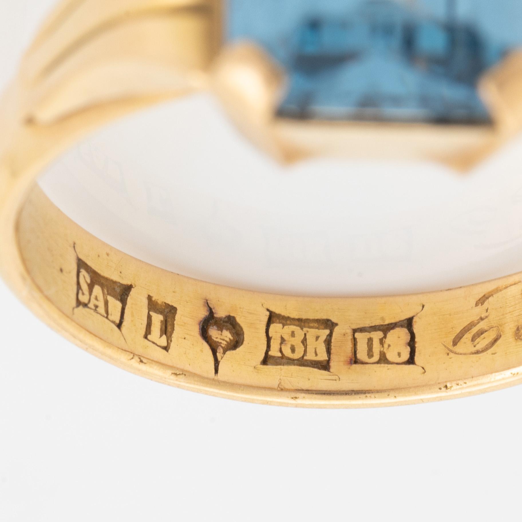 18K gold and synthetic blue spinel ring.