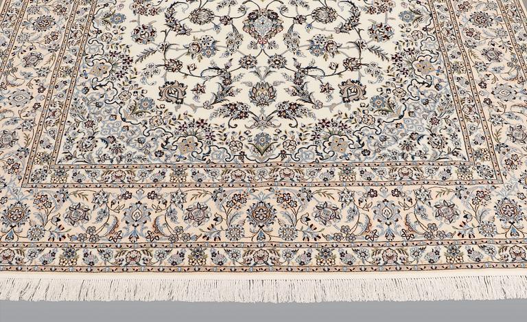 A carpet, Nain part silk s.k 6LAA, ca 310 X 209 cm.