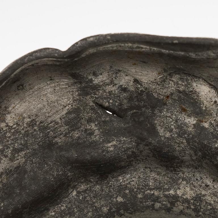 A mid 18th century rococo pewter jug.