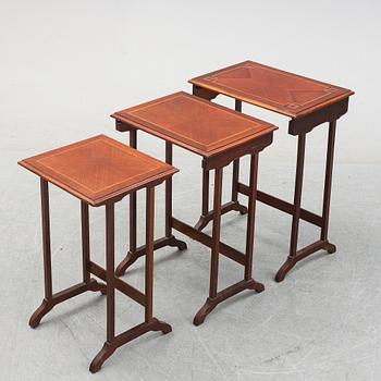 A three piece nesting table with inlay, first half of the 20th Century.
