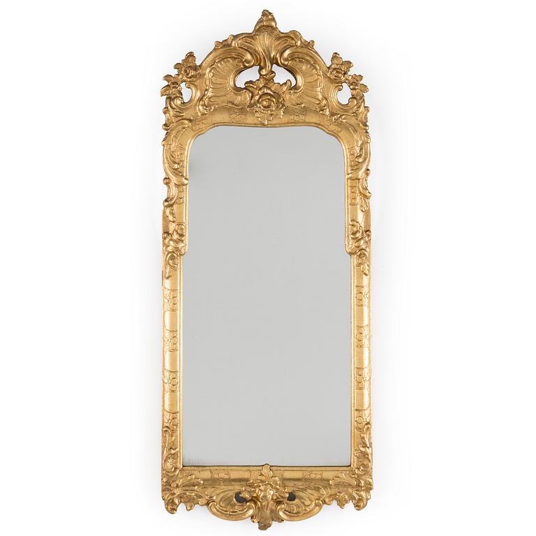 A Rococo mirror, 18th century.
