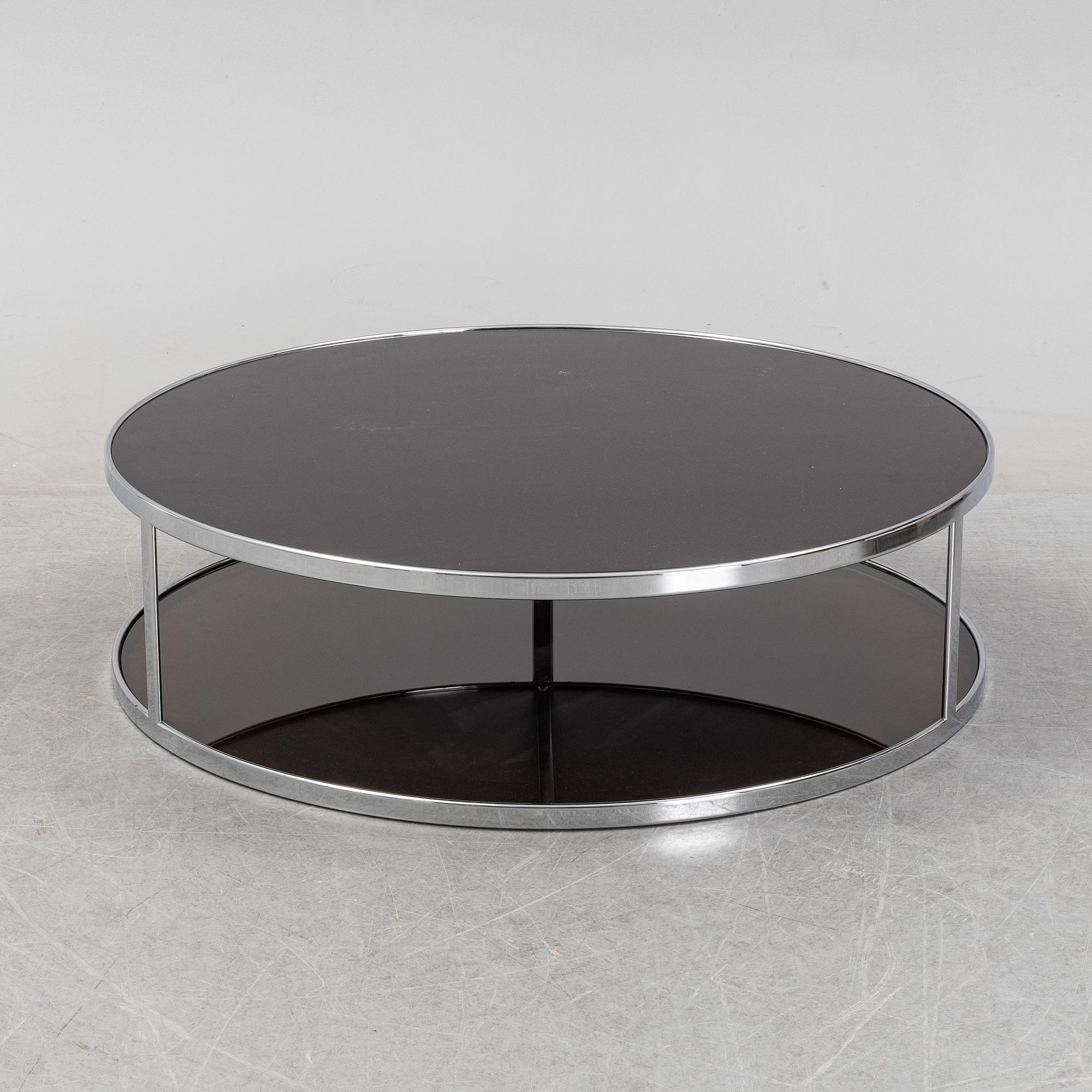 Rodolgo Dordoni, a 'Huber glass and chrome coffe table for Minotti.