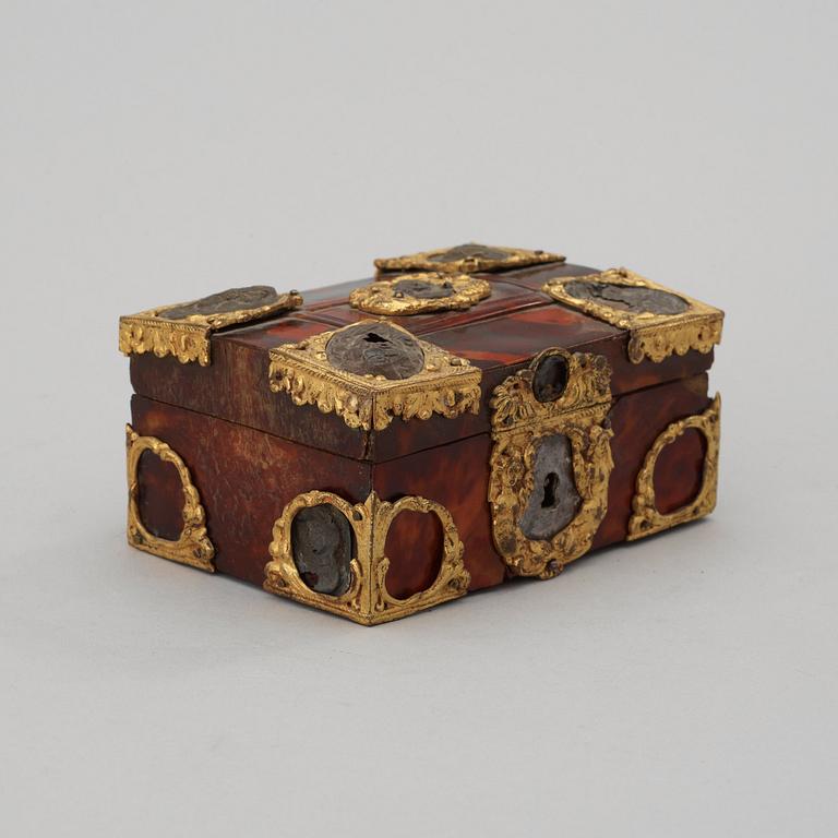 A Baroque 18th century tortoiseshell veneered casket.