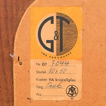 A 1950/60s walnut G&T mirror.