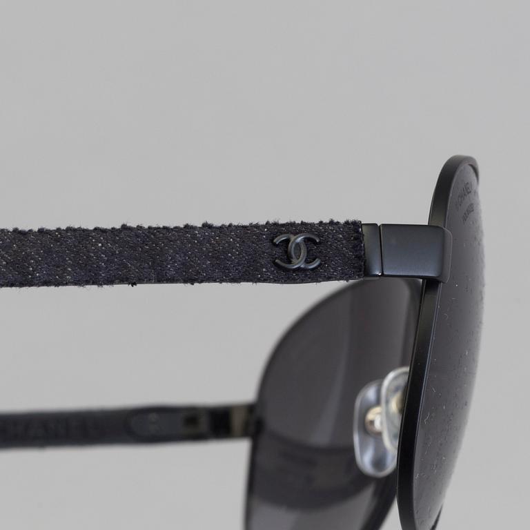 Chanel black pilot summer glasses.