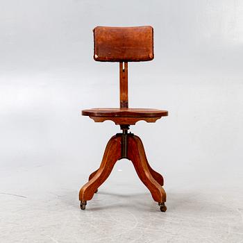 An early 1900s oak office chair.