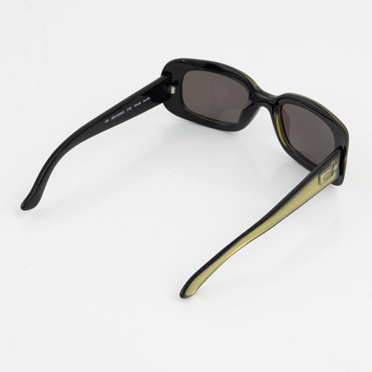 Gucci, a pair of green sunglasses.