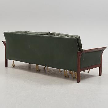 A 1960's Danish sofa, with 2 easy chairs and 2 tables by Glostrup.