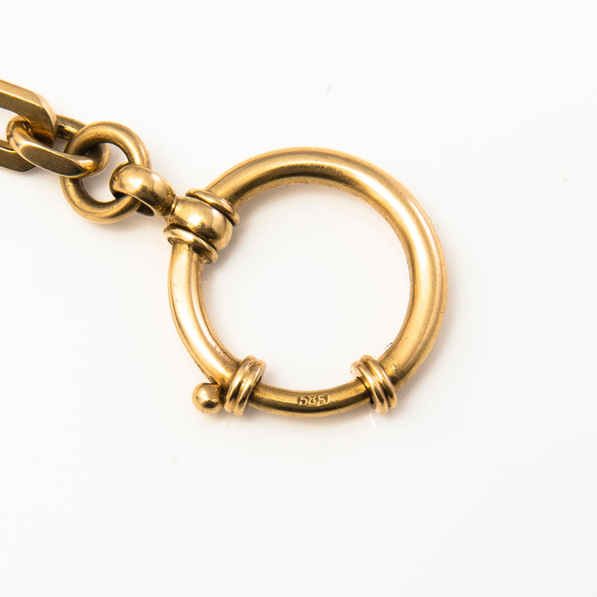 A 14K gold watch chain.