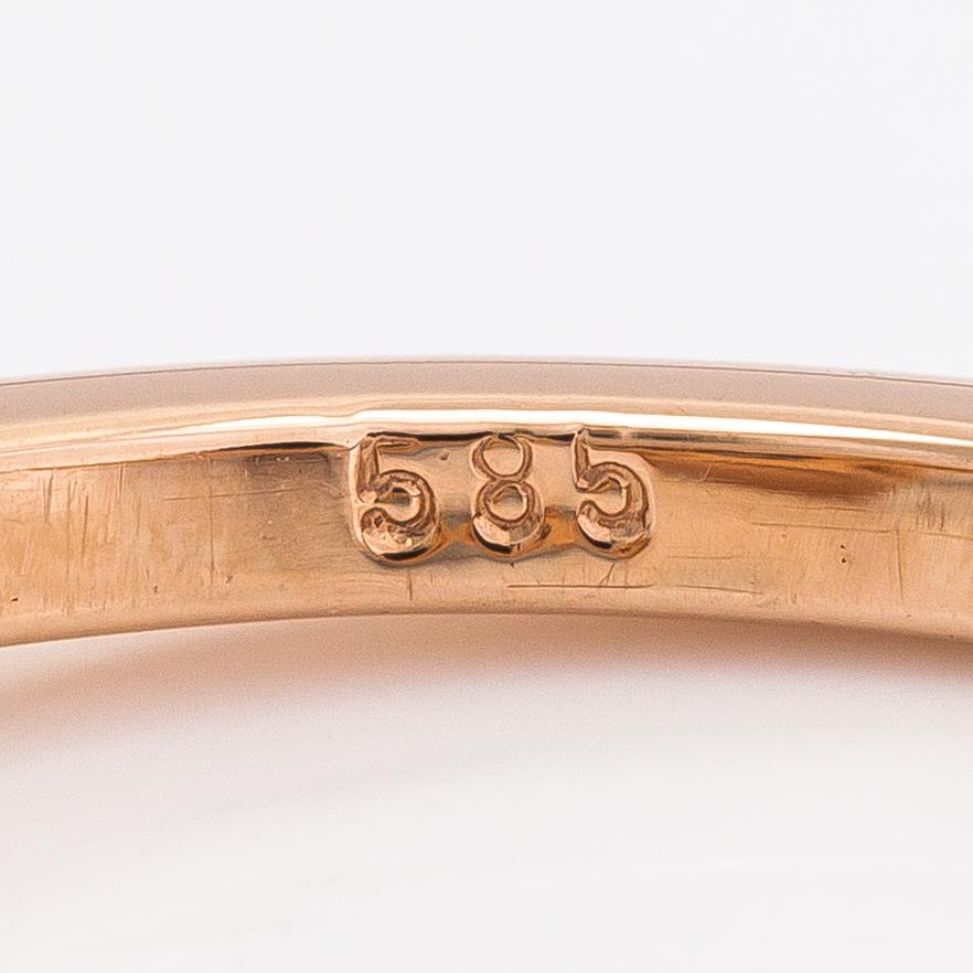 A 14K rosegold ring with diamonds ca. 1.38 ct in total. With AIG certificate.