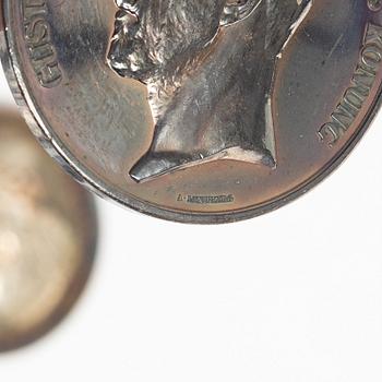 Twelve silver medals, Kungliga Myntverket, Sweden, early 20th century.