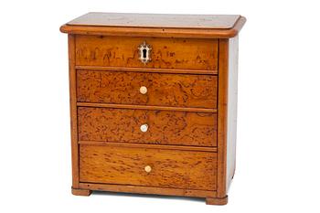 35. A MINIATURE COMMODE.