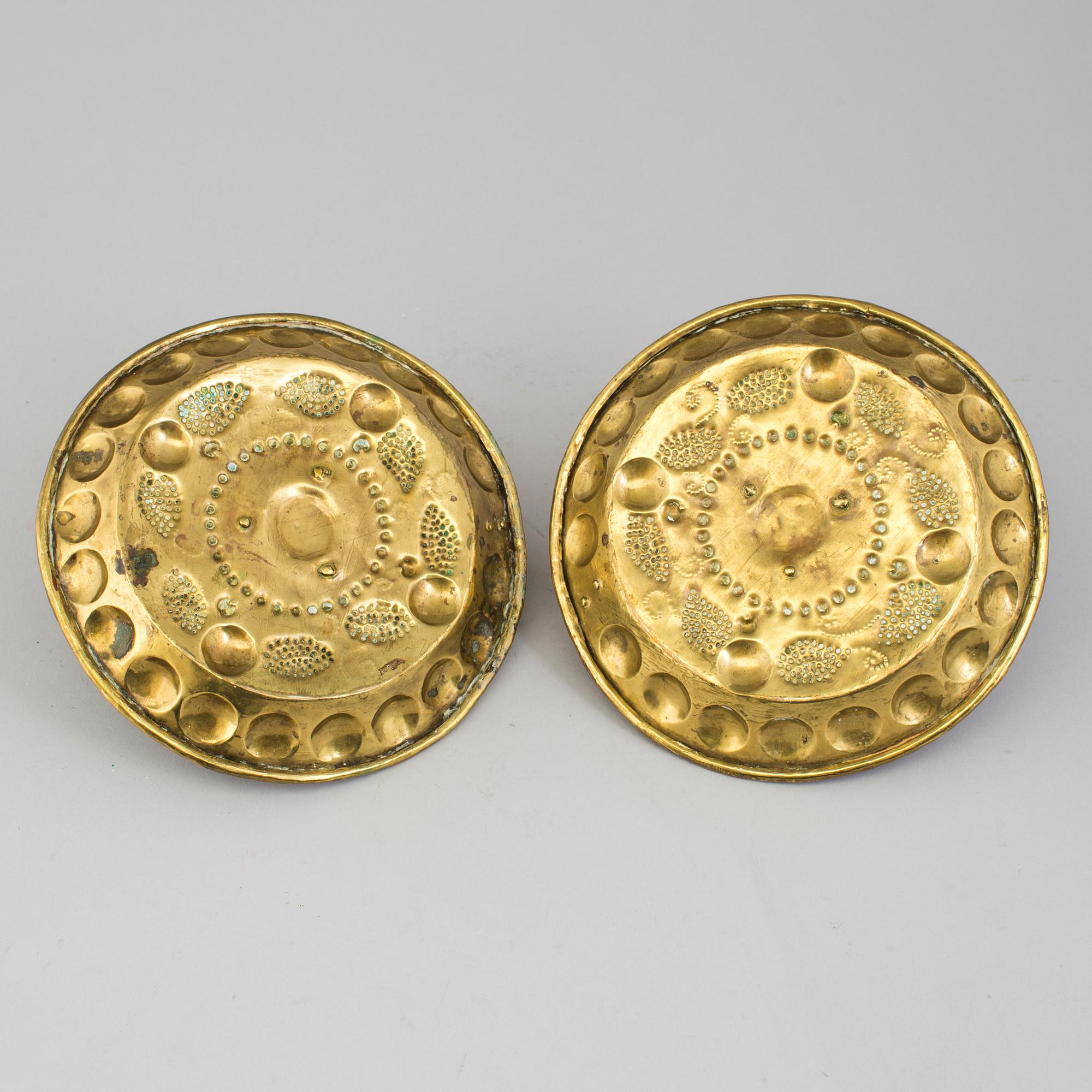 A pair of brass baroque style candlesticks.