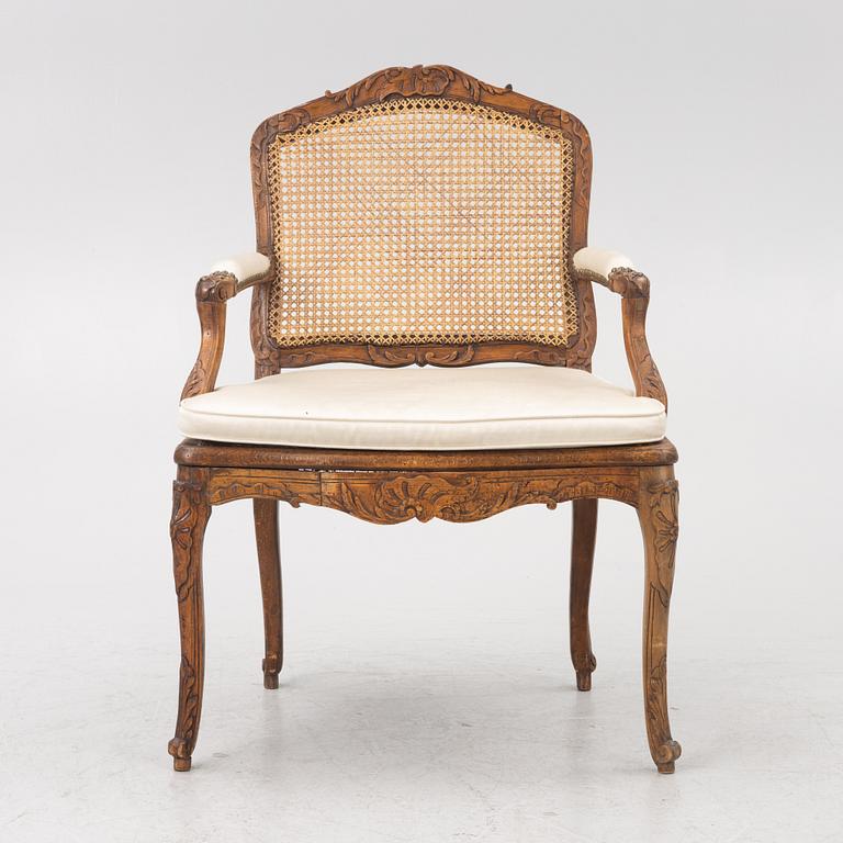 A French Louis XV armchair, mid 18th century.