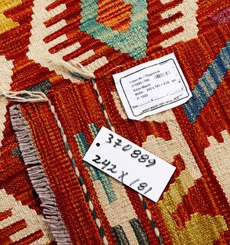 A Kilim rug, c. 242 x 181 cm.