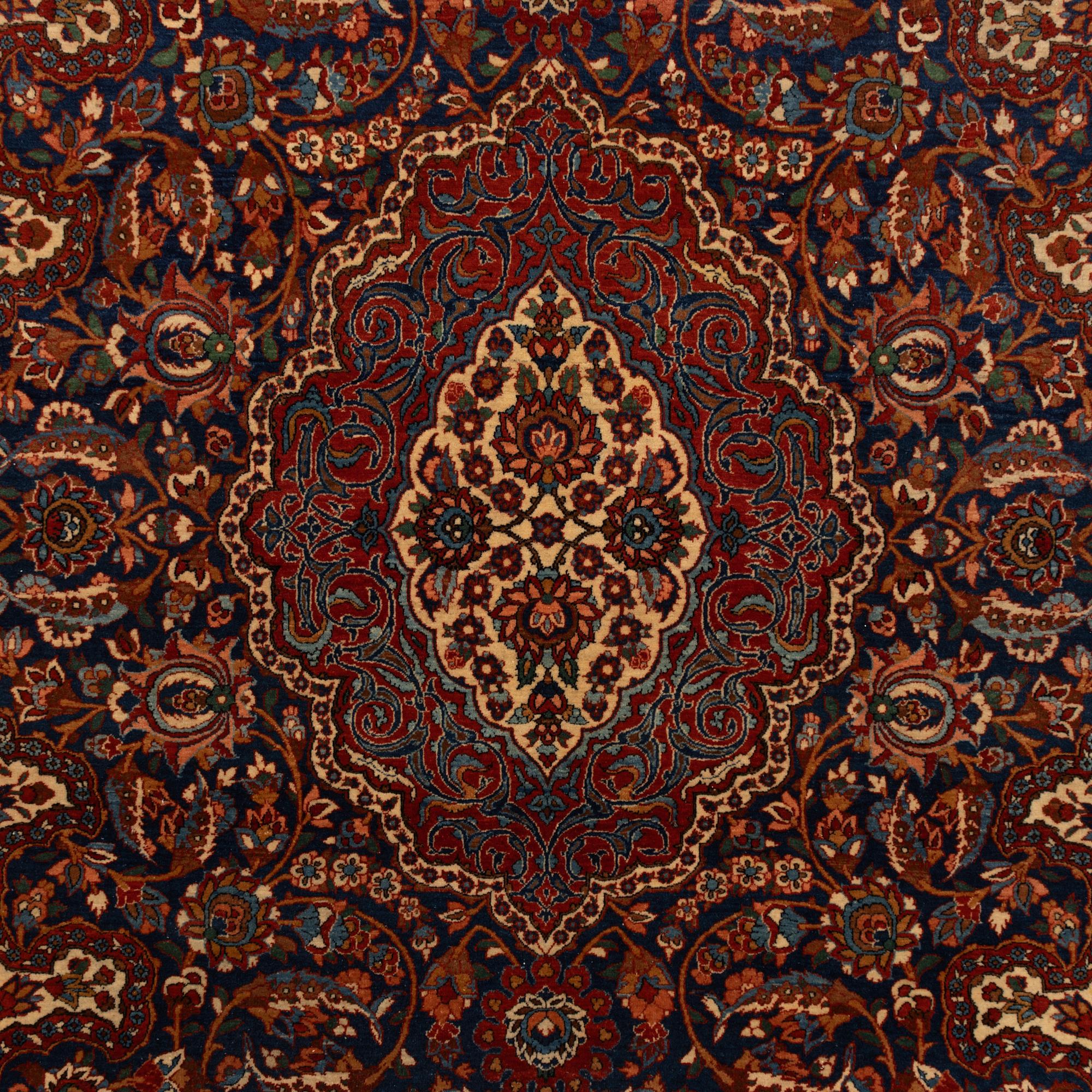 A semi-antique Isfahan rug, central Persia, c. 305 x 205 cm.