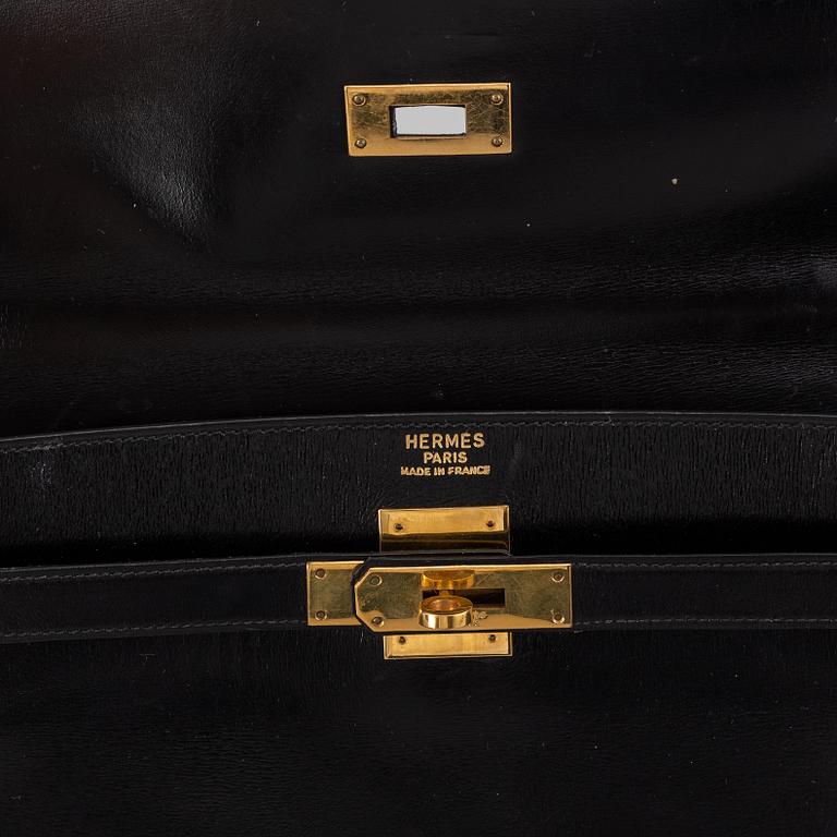 Hermès,a black leather 'Kelly 32' handbag, 1975.