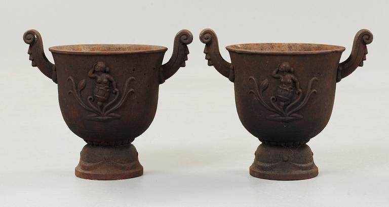 A pair of Ivar Johnsson 'Faun' cast iron urns, Näfveqvarns Bruk.