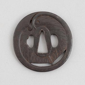Tsuba, Japan, signed Echizen Ju Kinai, mid-1600s.