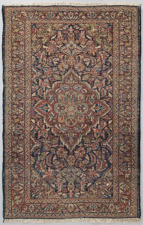 An oriental carpet. 197 x 127 cm.