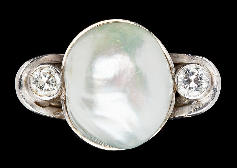 A baroque, possibly natural, pearl and diamond ring, tot. app. 0.30 cts, 1980's.
