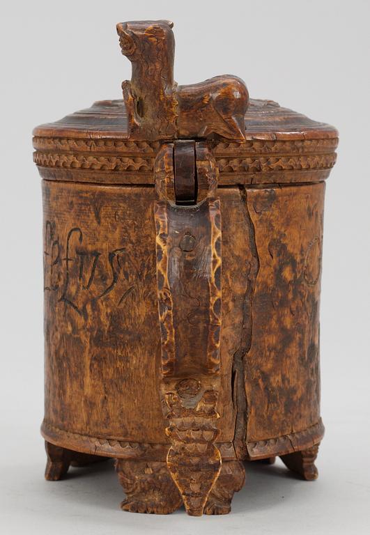 A Norwegian wooden tankard, dated 1741.