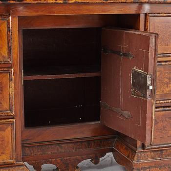 A Swedish late Baroque alder-veneered 'knee-hole' writing desk, first part of the 18th century.