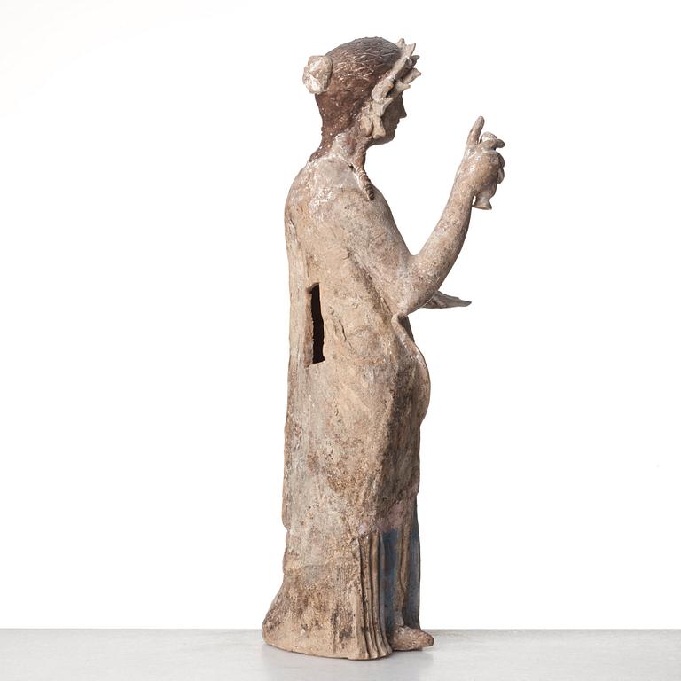 A Greek pottery sculpture of an elegant lady, Hellenistic, probably circa 300 B.C.