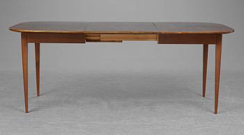 A Josef Frank walnut and mahogany dinner table, Firma Svenskt Tenn.