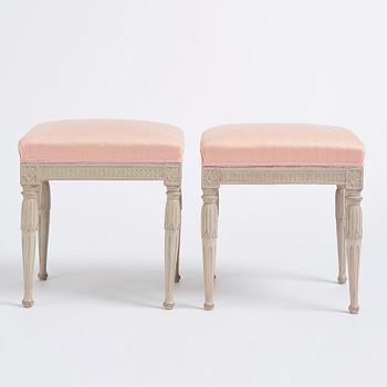 A pair of carved Gustavian stools by E. Öhrmark (master in Stockholm 1777-1813).