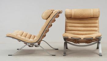 A pair of Arne Norell 'Ari' steel and leather easy chairs, Norell.