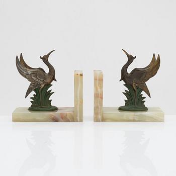 A pair of alabaster and  patinated metal Art Deco bookends from the first half of the 20th Century.