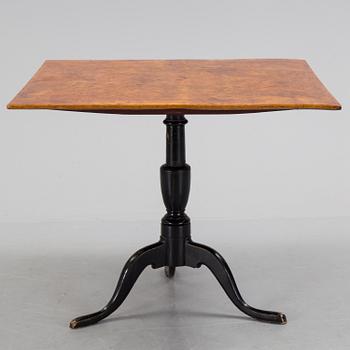 An burr alder veneered folding table, circa 1800.