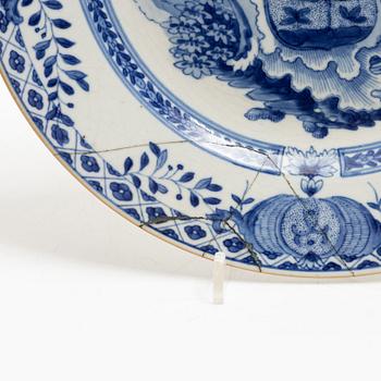 A pair of armorial dinner plates, soft paste, Qing dynasty, 18th century.