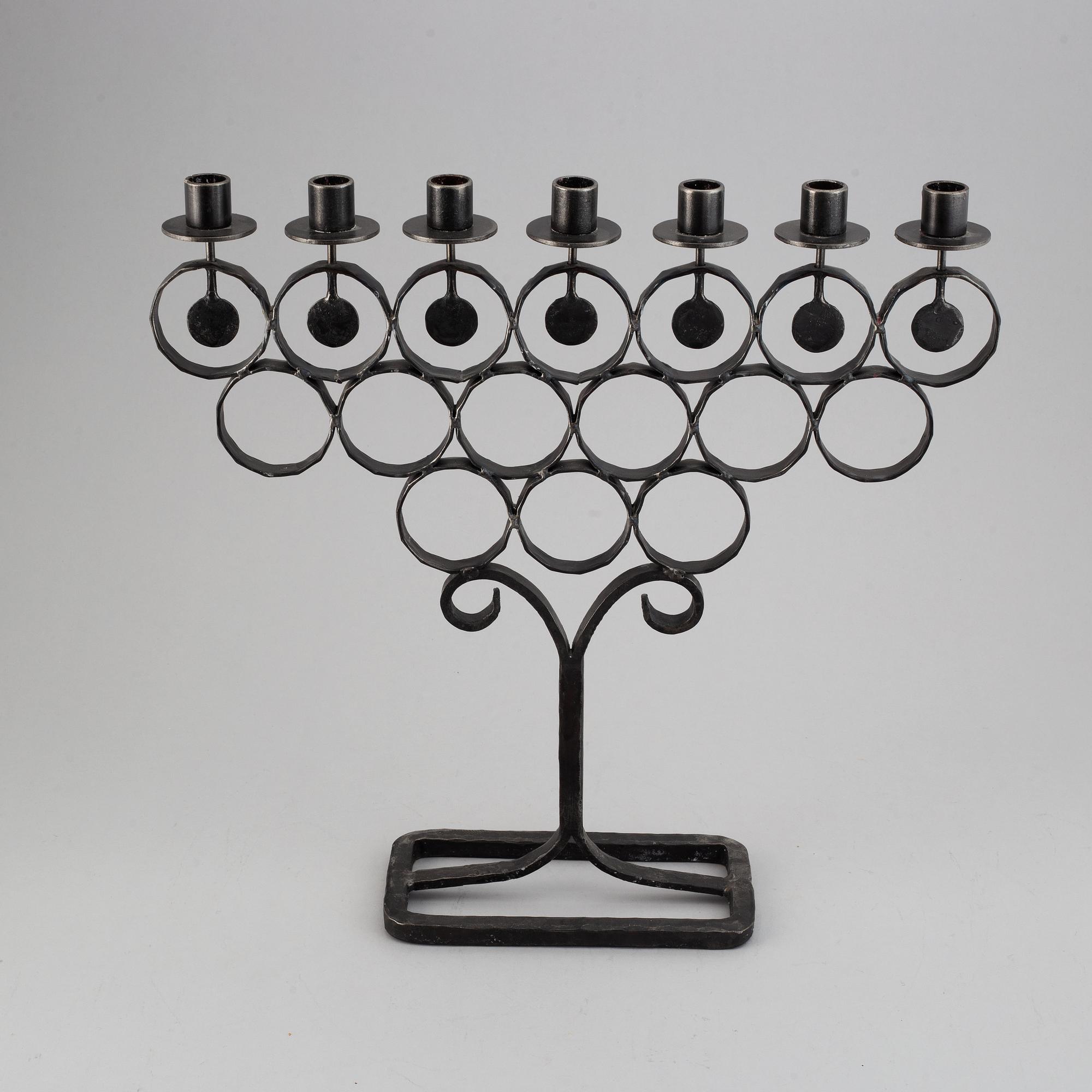 A cast iron candelabra by Bertil Vallien for Kosta Smide, Sweden.