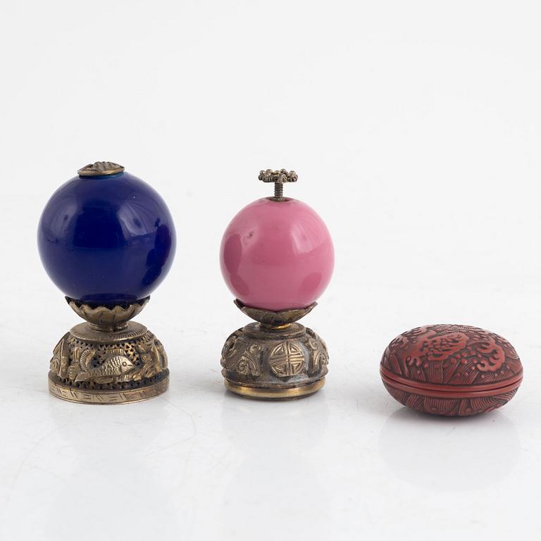 Two Chinese hat finials / mandarin insignias and a red lacquer box / button, late Qing dynasty.