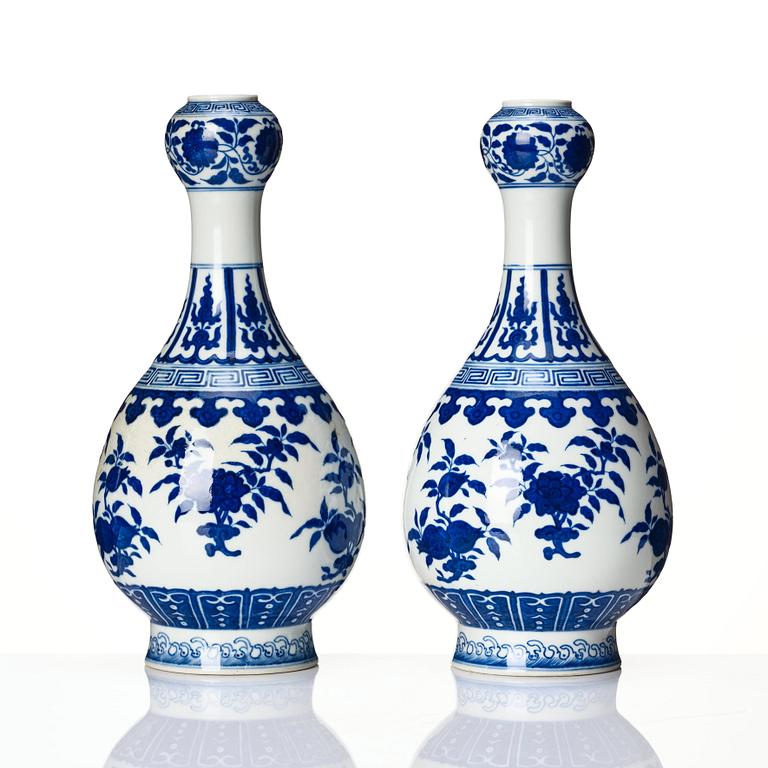 A pair of Chinese blue and white vases, late Qing dynasty/Republic with Qianlong seal mark.