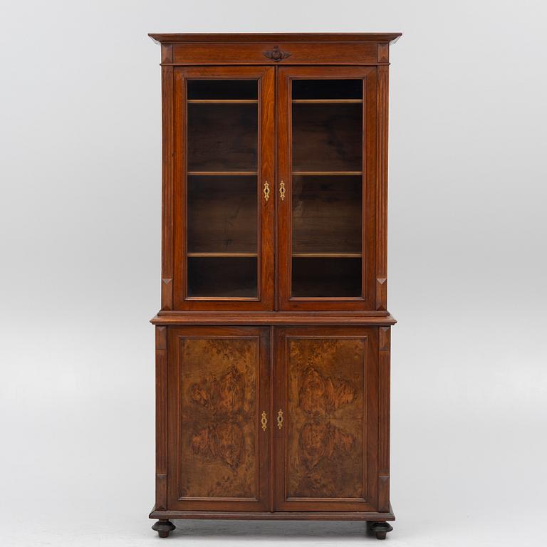 A two part mahogany cabinet, around 1900.