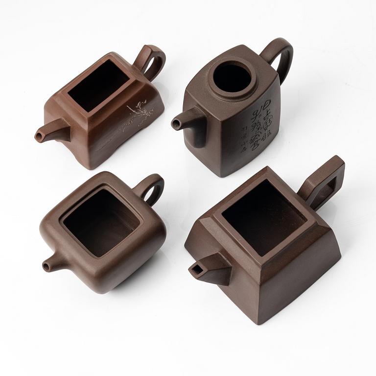 A group of four square yixing teapots, China, 1970/80s.