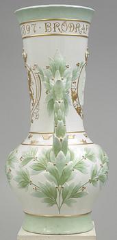 A Karl Lindström porcelain vase, decorated with the portrait of King Oscar II with his motto, Rörstrand 1897.