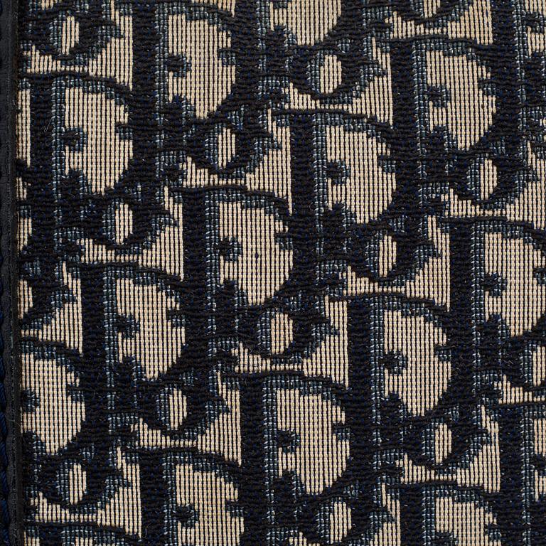 Christian Dior, a canvas handbag, toilet bag and key holder.