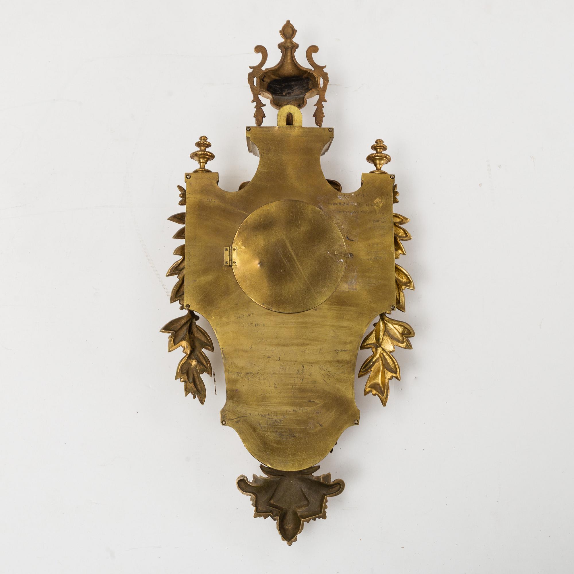 A first half of the 20th century brass wall clock.