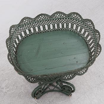 A wicker flower table, early 20th century.