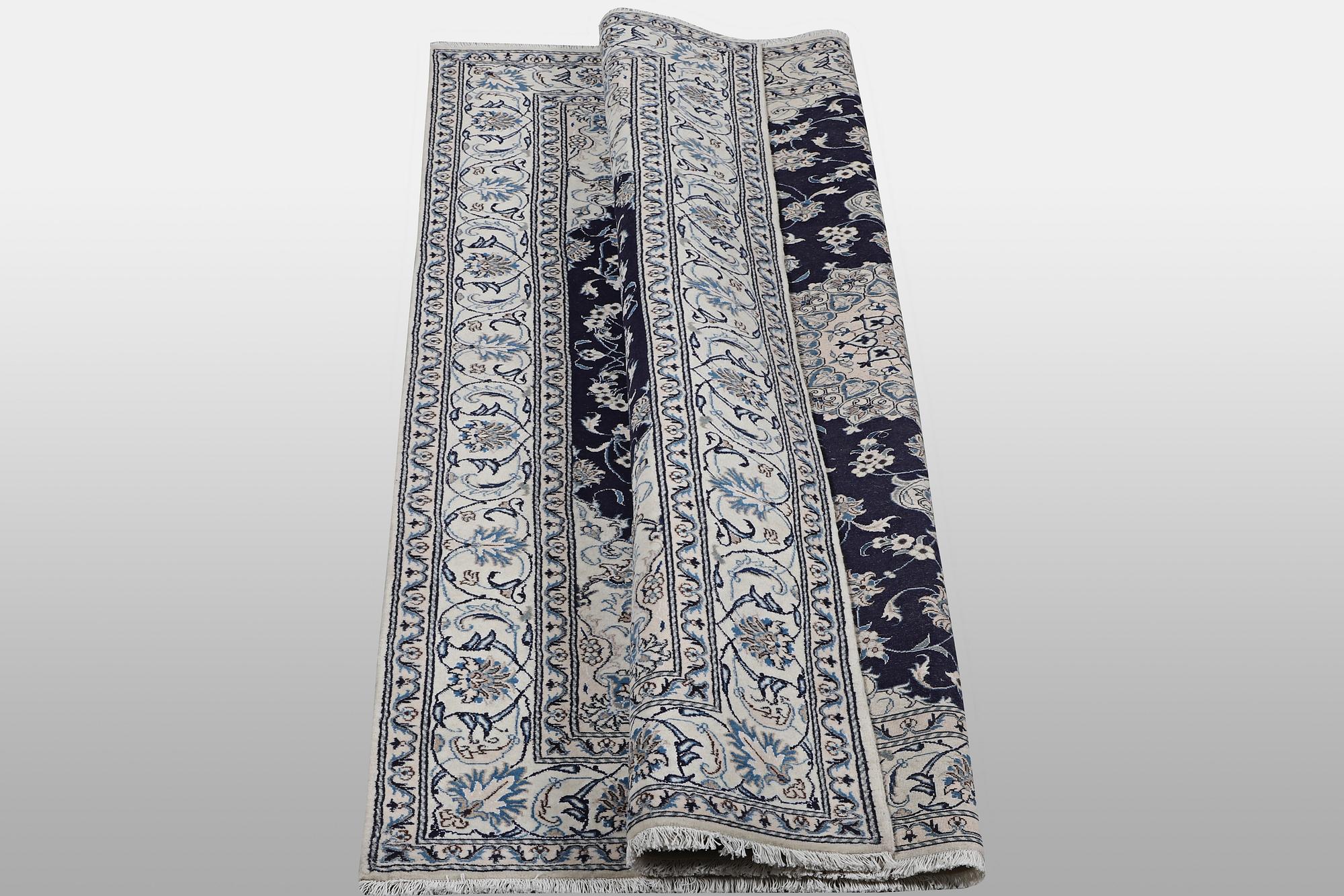 A carpet, Nain, part silk, ca 310 x 205 cm.