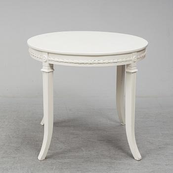 A gustavian style table and six chairs. First half of the 20th century.